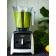 Vitamix A2500i white filled with green smoothie