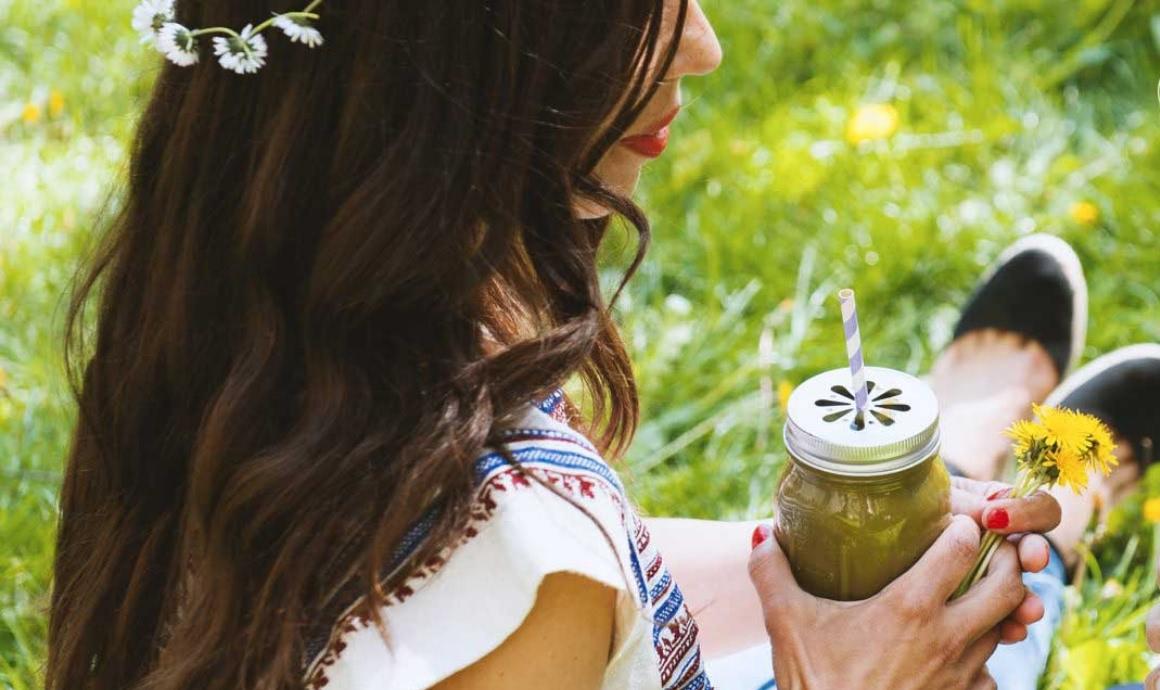 Carla drinking a detox smoothie with dandelion, nettle and goutweed