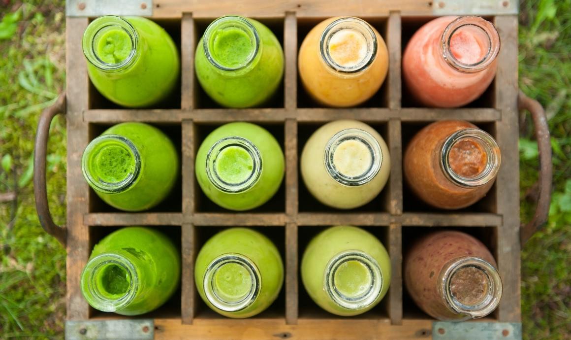 Various green smoothie varieties in bottles
