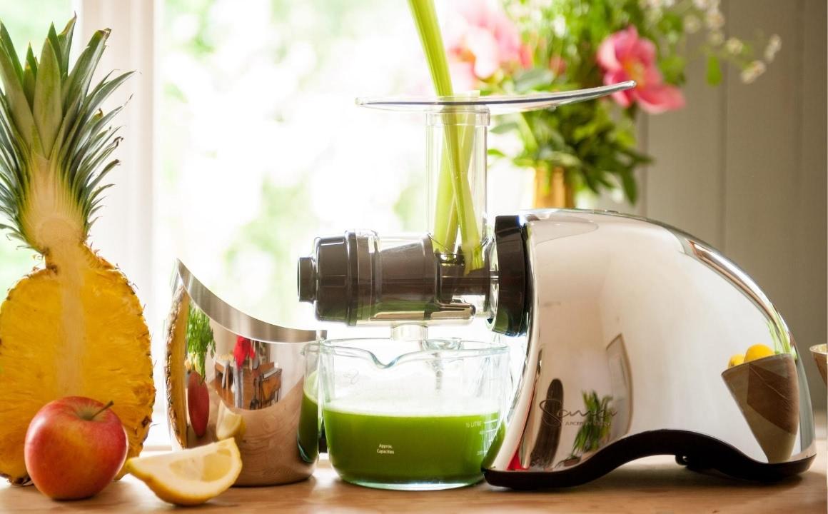 Sana Juicer by Omega 707 in chrome with juice jug and pulp jar