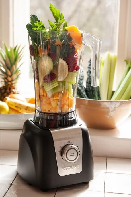 Wartmann blender filled with ingredients for green smoothies
